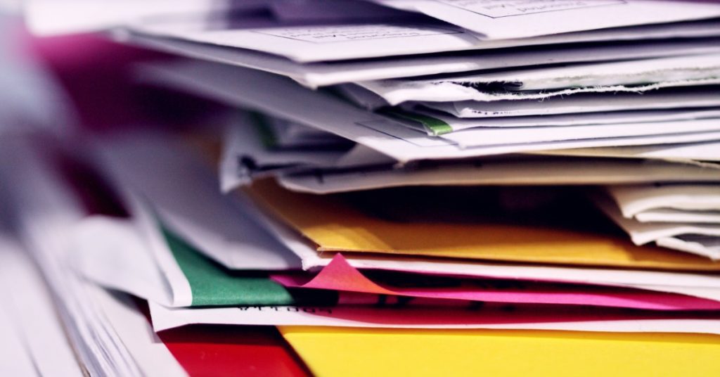 image of a stack of paper and folders
