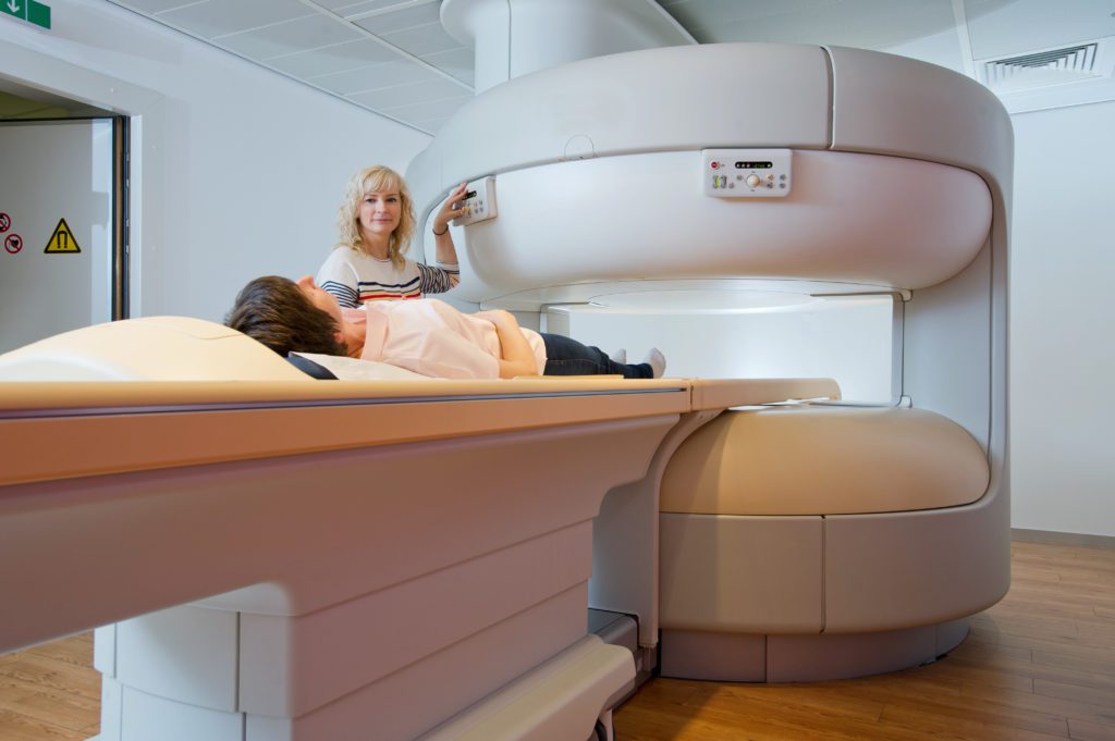 Open MRI patient being scanned