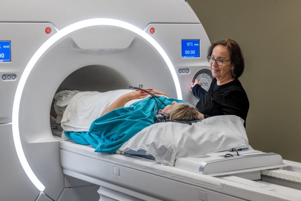 MRI Scanner and Patient with Radiology Tech