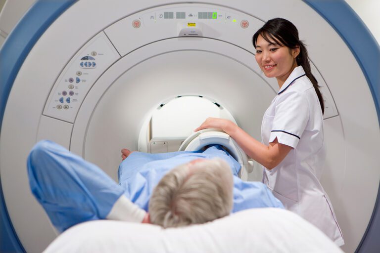 Radiology Technologist and Patient preparing for a Knee MRI