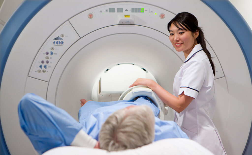 Radiology Technologist and Patient preparing for a Knee MRI