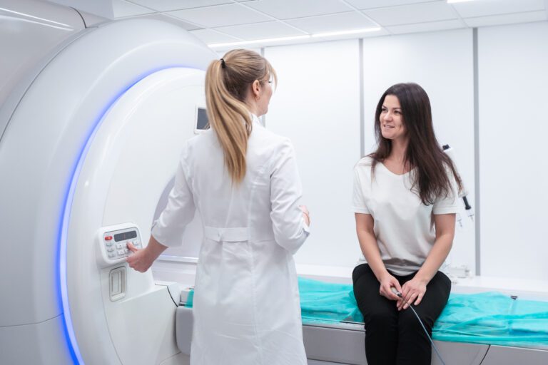 Radiologist Tech and Patient preparing for an MRI
