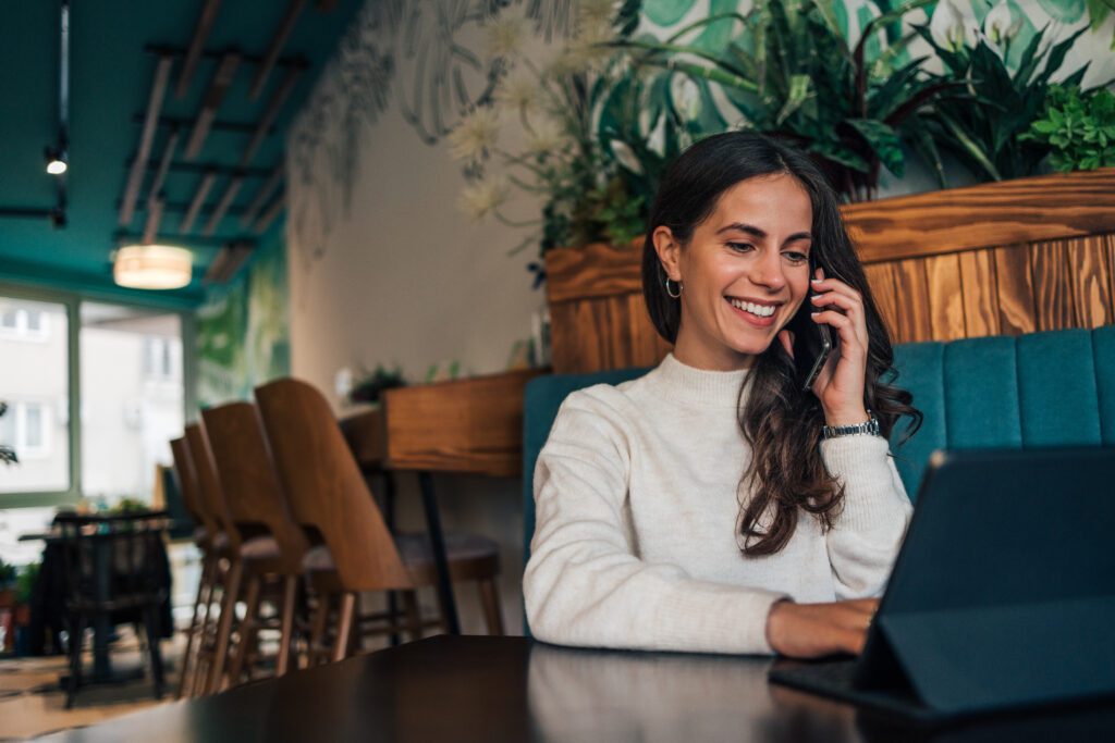 Woman talking on the phone ultrasound appointment for IVF cycle monitoring